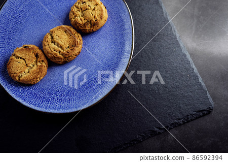 Blue plate with cookies Blue plate with cookies 86592394