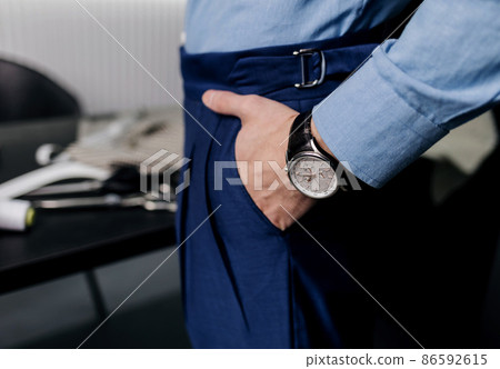 luxury watch on wrist of man 86592615