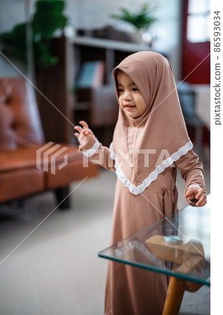 Cute Muslim toddler girl ini hijab at home Cute Muslim toddler girl ini hijab at home 86593034