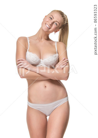 Young blonde woman in white underwear, studio 86593323