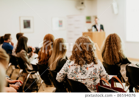 Audience in lecture hall on scientific conference. Audience in lecture hall on scientific conference. 86594076