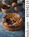 Breaded rustic pie with berries 86594216