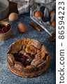 Breaded rustic pie with berries 86594223