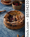 Breaded rustic pie with berries 86594230