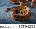 Breaded rustic pie with berries 86594232