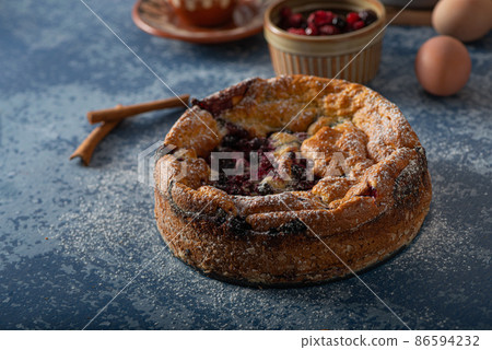 Breaded rustic pie with berries 86594232
