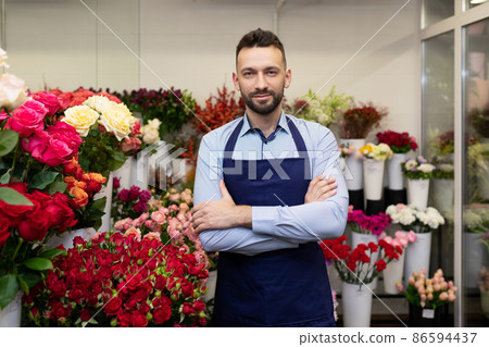 the owner of the flower business in the refrigerator on the background of fresh flowers the owner of the flower business in the refrigerator on the background of fresh flowers 86594437
