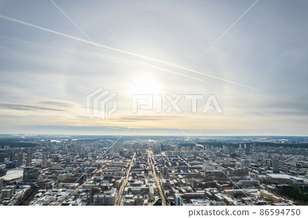 Yekaterinburg aerial panoramic view at Winter in cloudy day. Ekaterinburg is the fourth largest city in Russia located in the Eurasian continent on the border of Europe and Asia. Yekaterinburg aerial panoramic view at Winter in cloudy day. Ekaterinburg is the fourth largest city in Russia located in the Eurasian continent on the border of Europe and Asia. 86594750