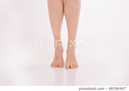 beautiful women's feet on white background beautiful women's feet on white background 86596407