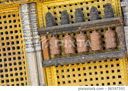 Tibetan copper prayer wheels, Swayambhunath Temple, Kathmandu, Nepal Tibetan copper prayer wheels, Swayambhunath Temple, Kathmandu, Nepal 86597391