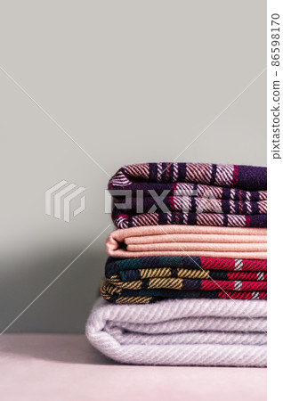 Stack of woolen checked blankets Stack of woolen checked blankets 86598170