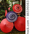 Large and small, stacked Japanese umbrellas Large and small, stacked Japanese umbrellas 86599363