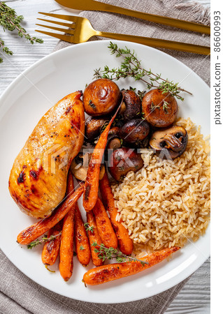 Chicken with rice, mushrooms and carrots Chicken with rice, mushrooms and carrots 86600993