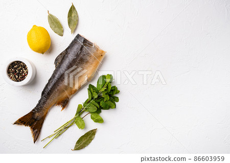 Golden smoked trout, on white stone table background, top view flat lay, with copy space for text Golden smoked trout, on white stone table background, top view flat lay, with copy space for text 86603959