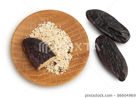 Tonka bean isolated on white background with clipping path and full depth of field. Bean of Dipteryx odorata, Top view. Flat lay 86604969