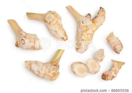 Fresh galangal root with slices isolated on white background with clipping path and full depth of field. Top view. Flat lay Fresh galangal root with slices isolated on white background with clipping path and full depth of field. Top view. Flat lay 86605036