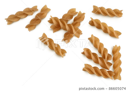 Wolegrain fusilli pasta from durum wheat isolated on white background with clipping path and full depth of field. Top view. Flat lay. Wolegrain fusilli pasta from durum wheat isolated on white background with clipping path and full depth of field. Top view. Flat lay. 86605074