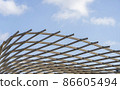 Abstract contemporary architecture details, white iron awning under clear sky in sunny day, Steel beam frame with blue sky as background. 86605494