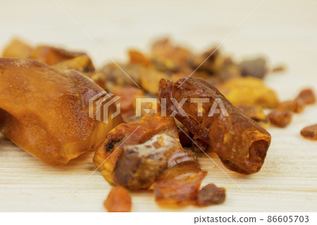 Amber. There are many different transparent pieces of amber, small and large, Ancient wood resin as a mineral for jewelers. The Sunstone 86605703