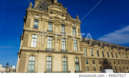 Architectural details of Louvre Museum in Paris, France. This central landmark of Paris is one of the world's largest museums. 86607917