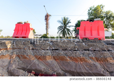 Side of the broken asphalt road collapsed and fallen.  86608148