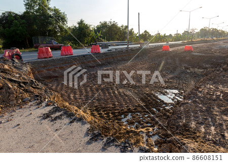 Side of the broken asphalt road collapsed and fallen.  86608151