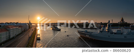 Aerial panoramic landscape of warships in the waters of the Neva River before the holiday of the Russian Navy, sea power, the latest cruisers among the sights, Isaac cathedral on a background 86608620