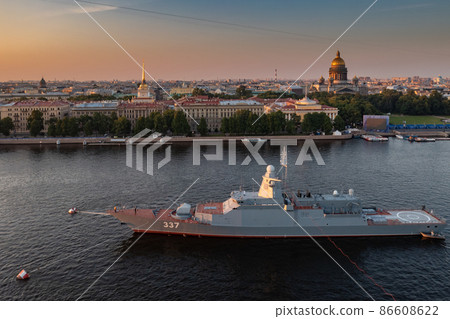 Aerial morning urban landscape with warships in the waters of the Neva River before the holiday of the Russian Navy, sea power, the latest cruisers among the sights, Isaac cathedral on a background Aerial morning urban landscape with warships in the waters of the Neva River before the holiday of the Russian Navy, sea power, the latest cruisers among the sights, Isaac cathedral on a background 86608622