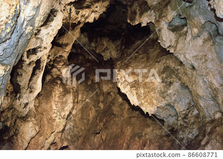 entrance to the cave in the rock in Slovakia 86608771