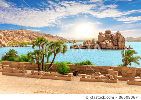 Rocks in lake Nasser of the Nile river near Philae temple, Aswan, Egypt Rocks in lake Nasser of the Nile river near Philae temple, Aswan, Egypt 86609067