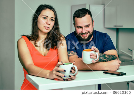 Employees are talking during coffee break in office. 86610360