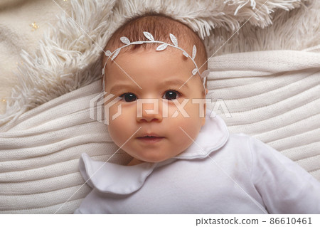 Adorable caucasian baby girl portrait. Top view.  86610461