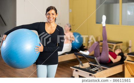 Portrait of a latin american woman with a fitball 86611981