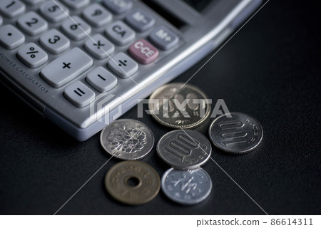 Coin and calculator 86614311