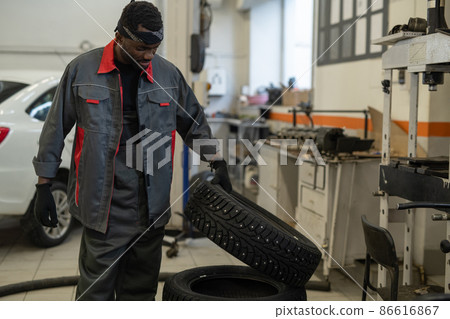 Black Mechanic in Workshop 86616867