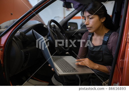 Female Mechanic in Car Female Mechanic in Car 86616893