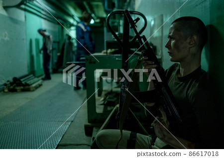 Female Soldier Hiding from Zombies Female Soldier Hiding from Zombies 86617018