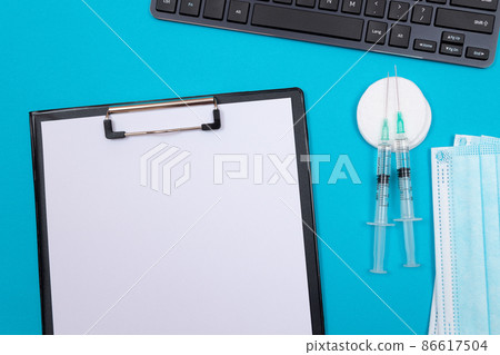 Vaccination or Revaccination Concept - Two Medical Syringe on Blue Table 86617504
