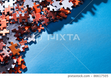 Colorful Jigsaw Puzzle on Blue Background 86617505