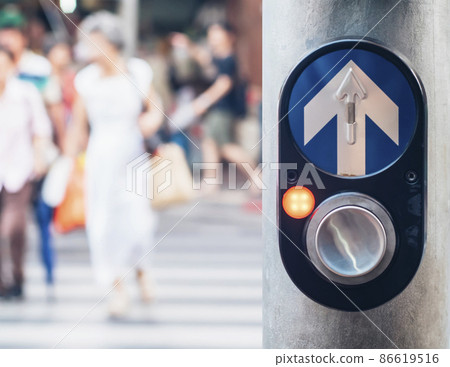 Pedestrian traffic light crossing push button controller in Bangkok Thailand . Car accident campaign idea background.Blurred people across the road in city. Pedestrian traffic light crossing push button controller in Bangkok Thailand . Car accident campaign idea background.Blurred people across the road in city. 86619516
