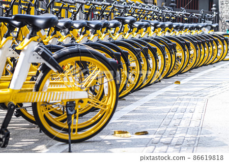 December 2019 Guangzhou china rental bikes found along the main street to serve public and connect from area to other. Bicycle parking sign in public park December 2019 Guangzhou china rental bikes found along the main street to serve public and connect from area to other. Bicycle parking sign in public park 86619818