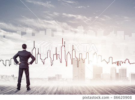 Motivation and inspiration concept with modern cityscape and businessman observing it 86620908