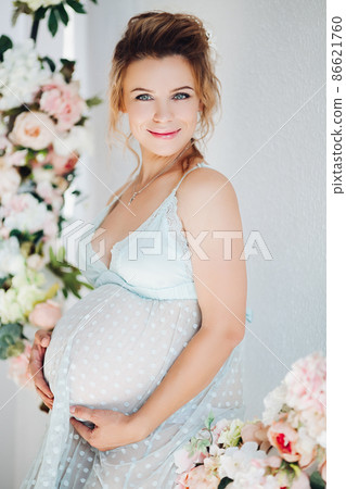 Sensuality pregnant in lingerie dress embrasing Sensuality pregnant in lingerie dress embrasing 86621760