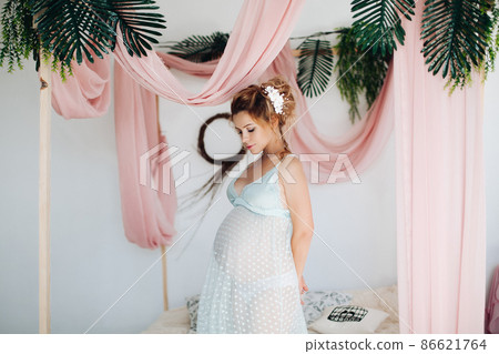 Beautiful pregnant woman in nighty dress posing 86621764