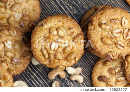 wheat-oatmeal cookies with peanuts, closeup wheat-oatmeal cookies with peanuts, closeup 86622297
