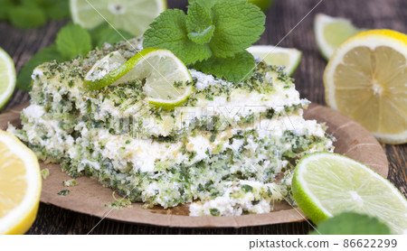 green cake with cream and lime green cake with cream and lime 86622299