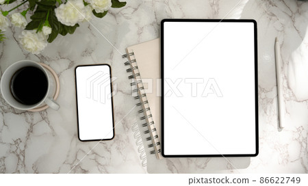 Modern female office desk with tablet, smartphone blank display on marble background. Modern female office desk with tablet, smartphone blank display on marble background. 86622749