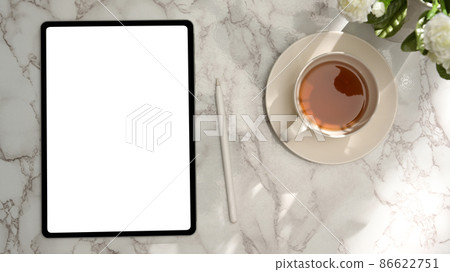Overhead, A digital tablet touchpad mockup on marble background. Overhead, A digital tablet touchpad mockup on marble background. 86622751