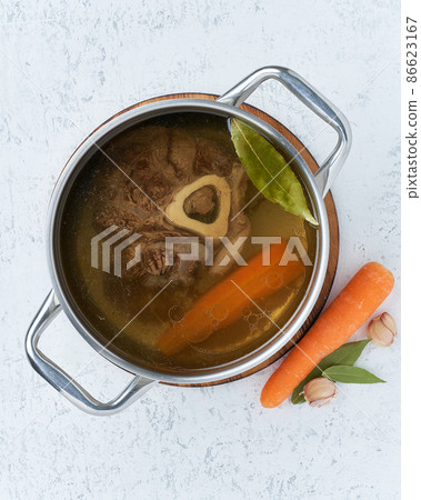 Paleo bone broth diet, beef meat soup. Low-carb food, keto recipe. Paleo bone broth diet, beef meat soup. Low-carb food, keto recipe. 86623167