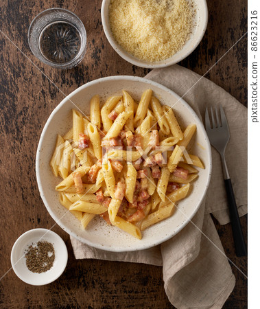 Carbonara pasta. Penne with pancetta, egg, parmesan cheese and cream sauce Carbonara pasta. Penne with pancetta, egg, parmesan cheese and cream sauce 86623216